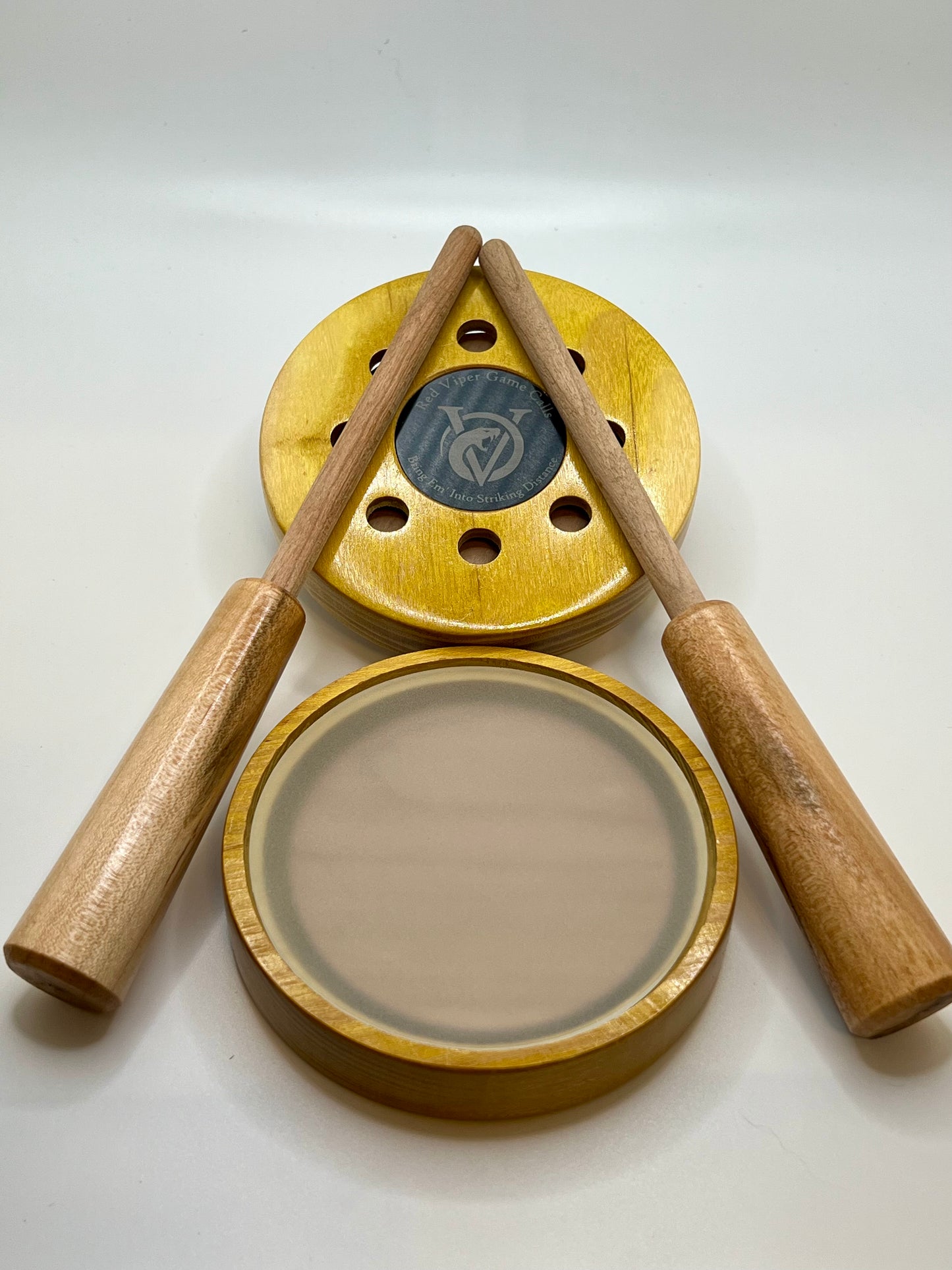 Osage Orange Pot Call. Up close with Red Viper Game Calls logo and slogan “Bring ‘em Into Striking Distance” engraved on an anodized aluminum coin that is inlayed in the center of the call. Great looking and sounding turkey call.