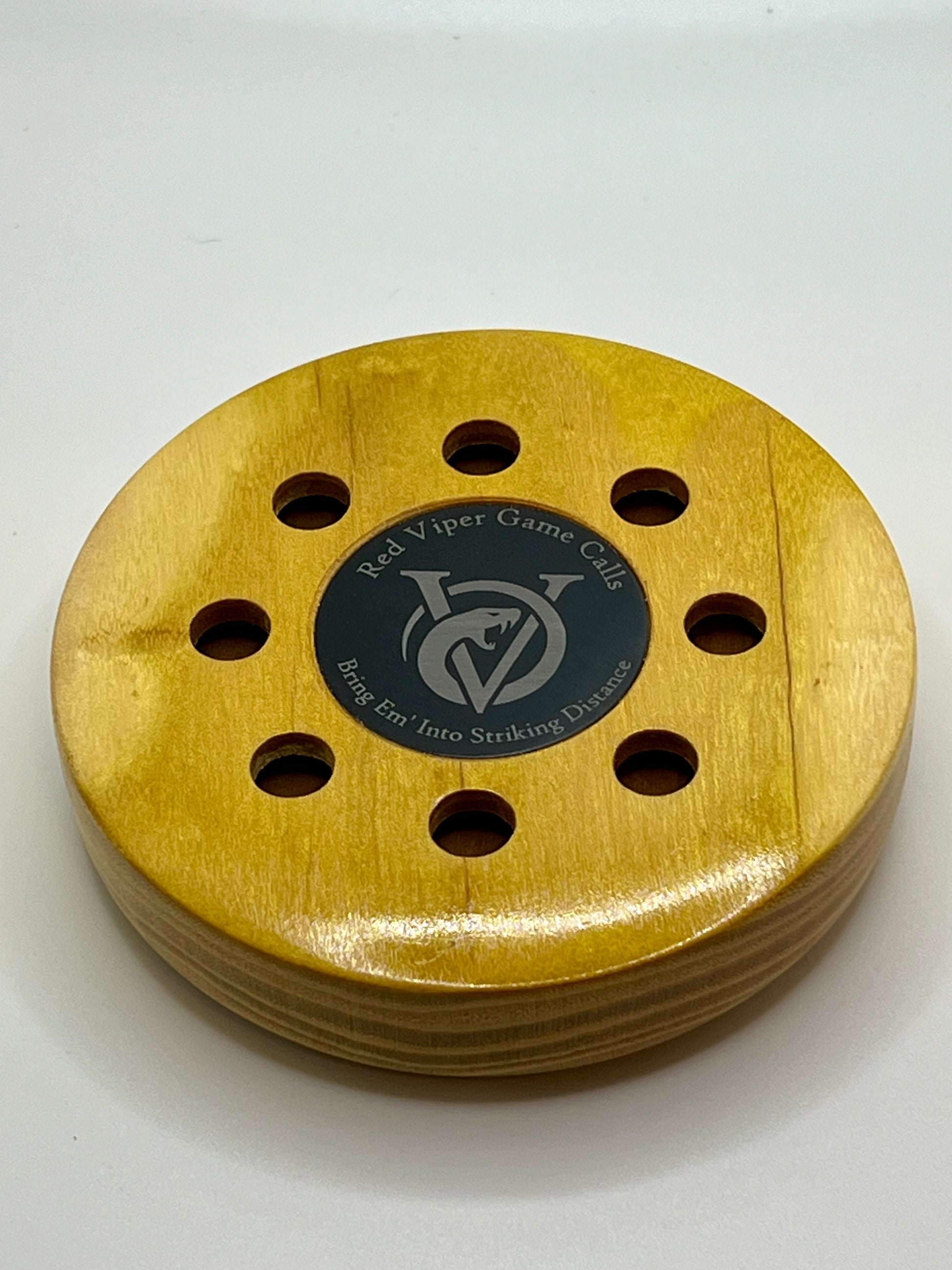 Osage Orange Pot Call. Up close with Red Viper Game Calls logo and slogan “Bring ‘em Into Striking Distance” engraved on an anodized aluminum coin that is inlayed in the center of the call. Great looking and sounding turkey call. 